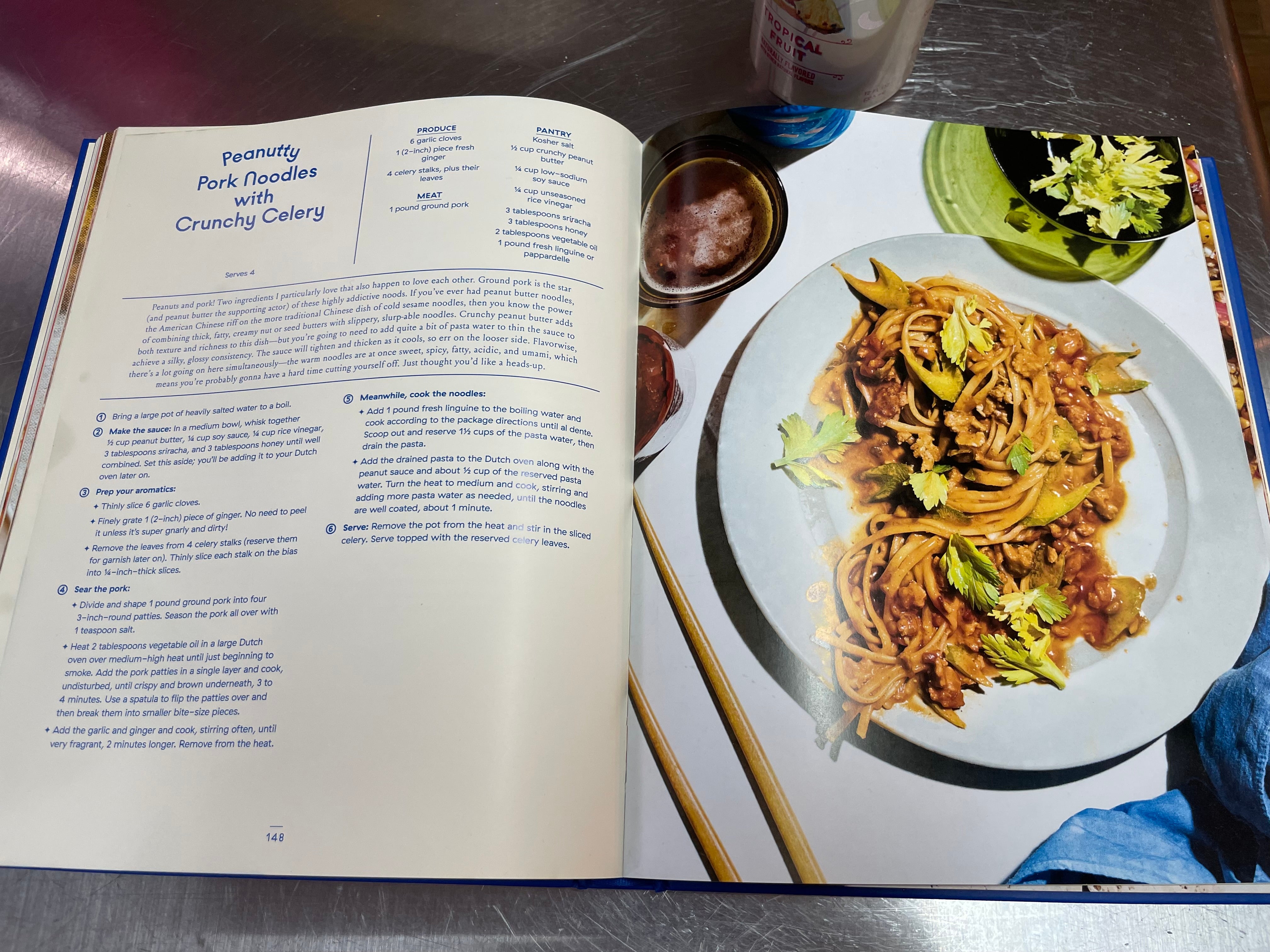 Cookbook open to recipe titled Peanutty pork noodles with crunchy celery